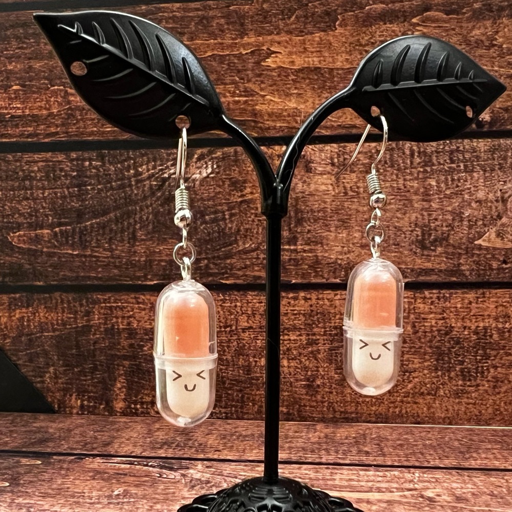 Happy pill dangle earrings